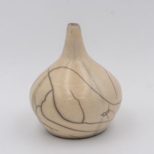 a small raku single stem vase