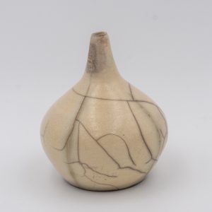 a small raku single stem vase, white/off white with complex crackles glaze patterns